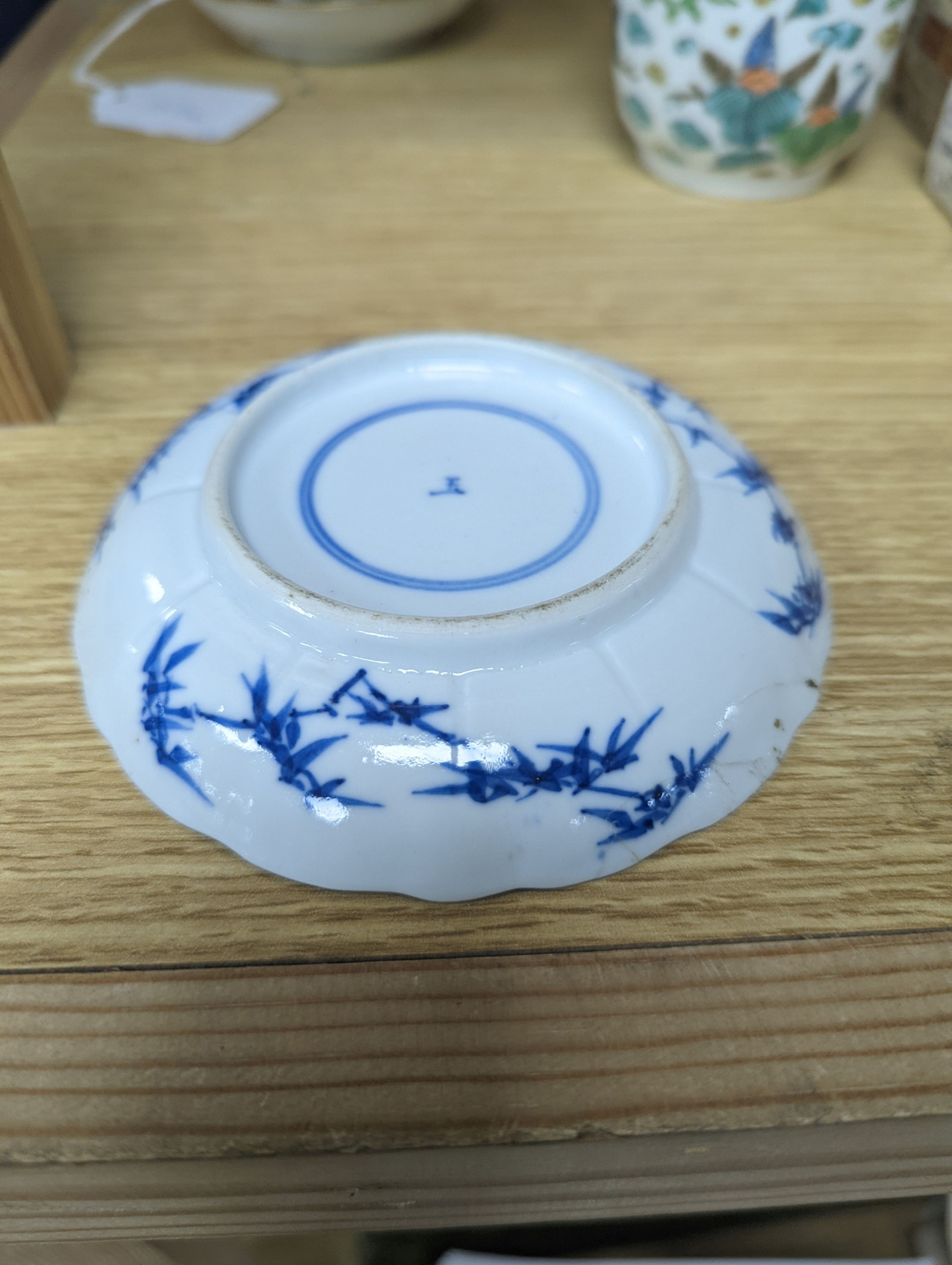 Two Chinese porcelain saucer dishes and an enamelled porcelain vase, 18th century and later, 12.5cm